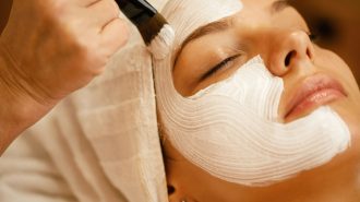 Close-up of facial treatment with detox mask.