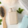 Composition with hair care products on wooden background, top view