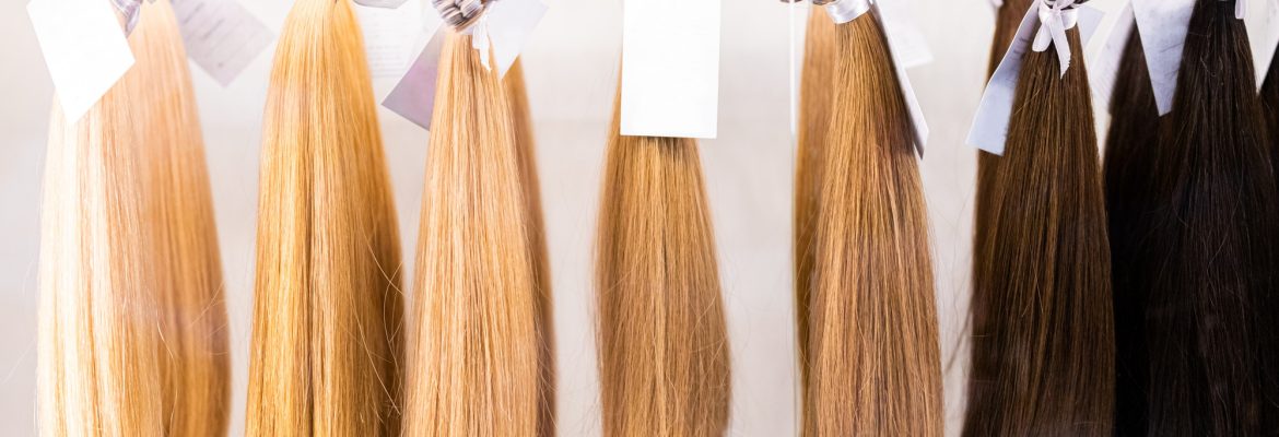 Exhibition of multicolored hair extensions in beauty salon