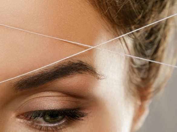 Eyebrow threading - epilation procedure for brow shape correction